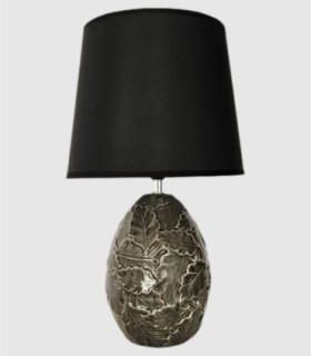 Table lamp with decorative leaf base, black shade.